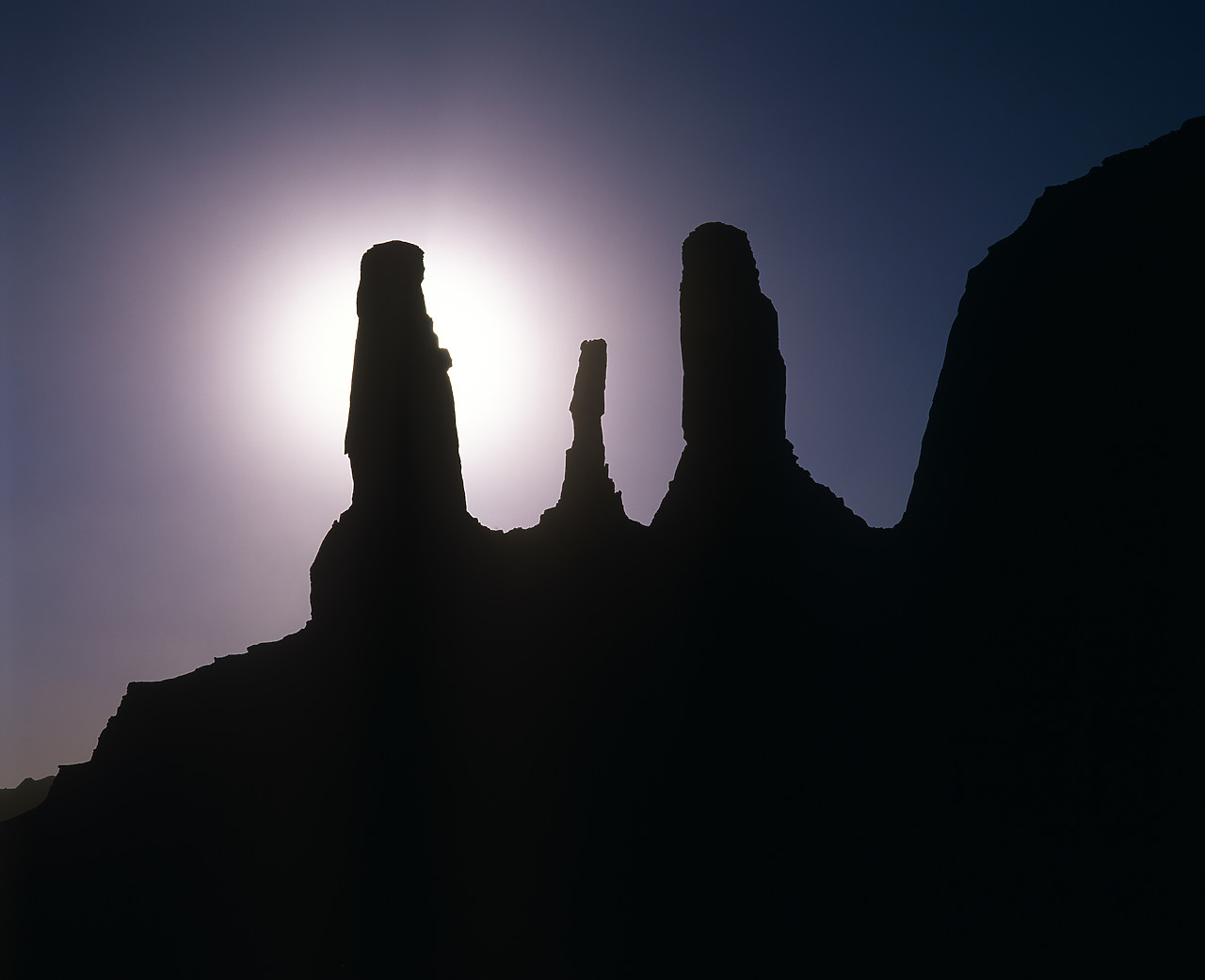 #010719-1 - Three Sisters Butte in Silhouette, Monument Valley, Arizona, USA