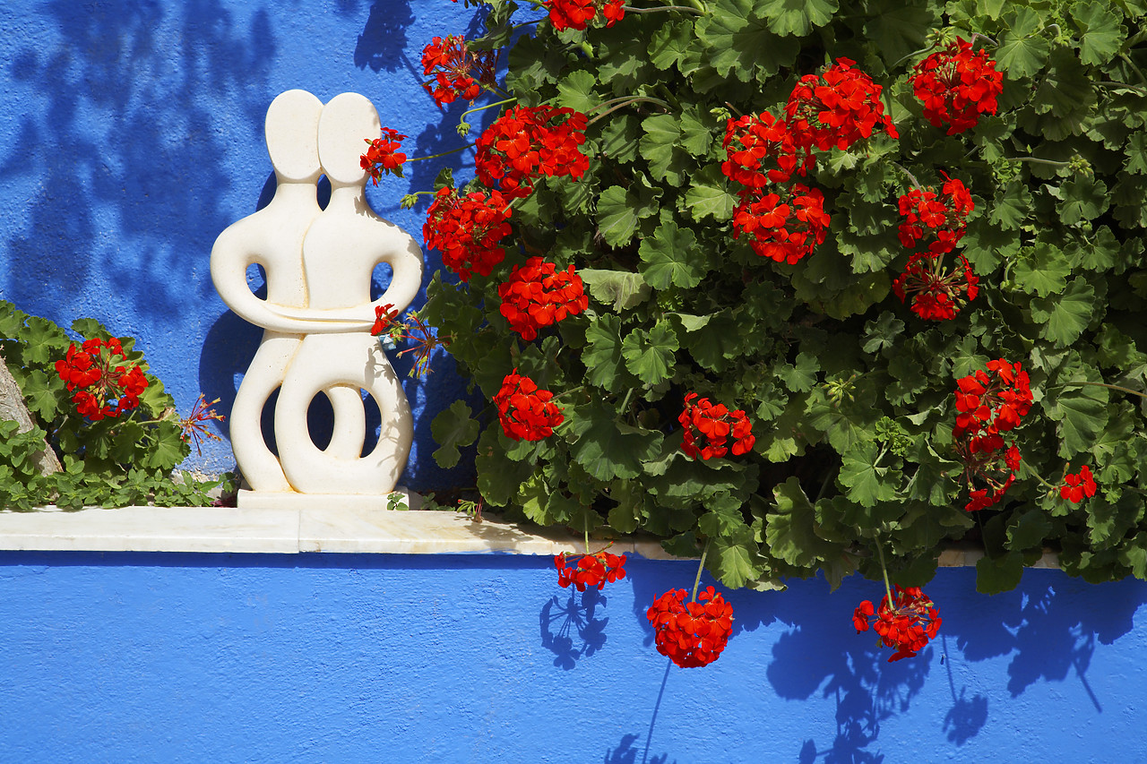 #060282-1 - Modern Sculpture & Geraniums, Oia, Santorini, Greece