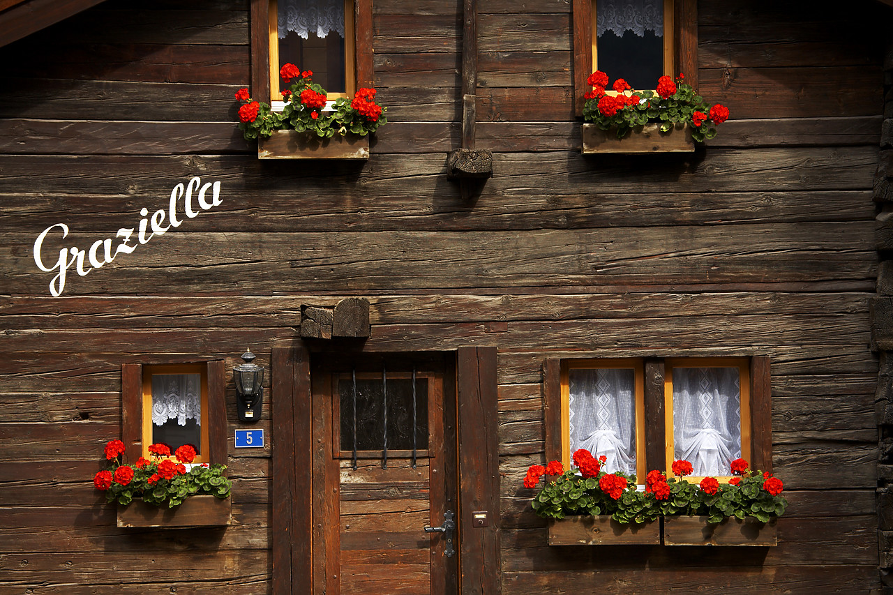 #060386-1 - Chalet with Red Geraniums, Zermatt, Switzerland