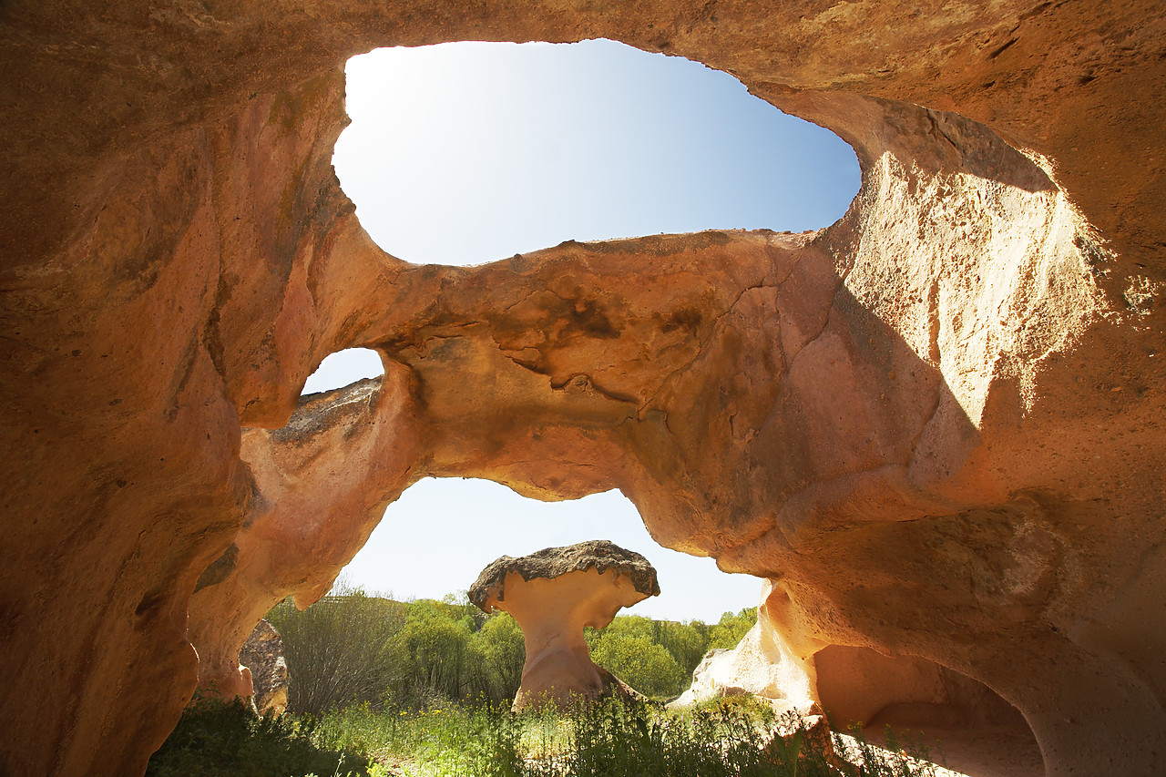 #070235-1 - Cave Framing Mushroom Rock Formation, near Gulsehir, Cappadocia, Turkey