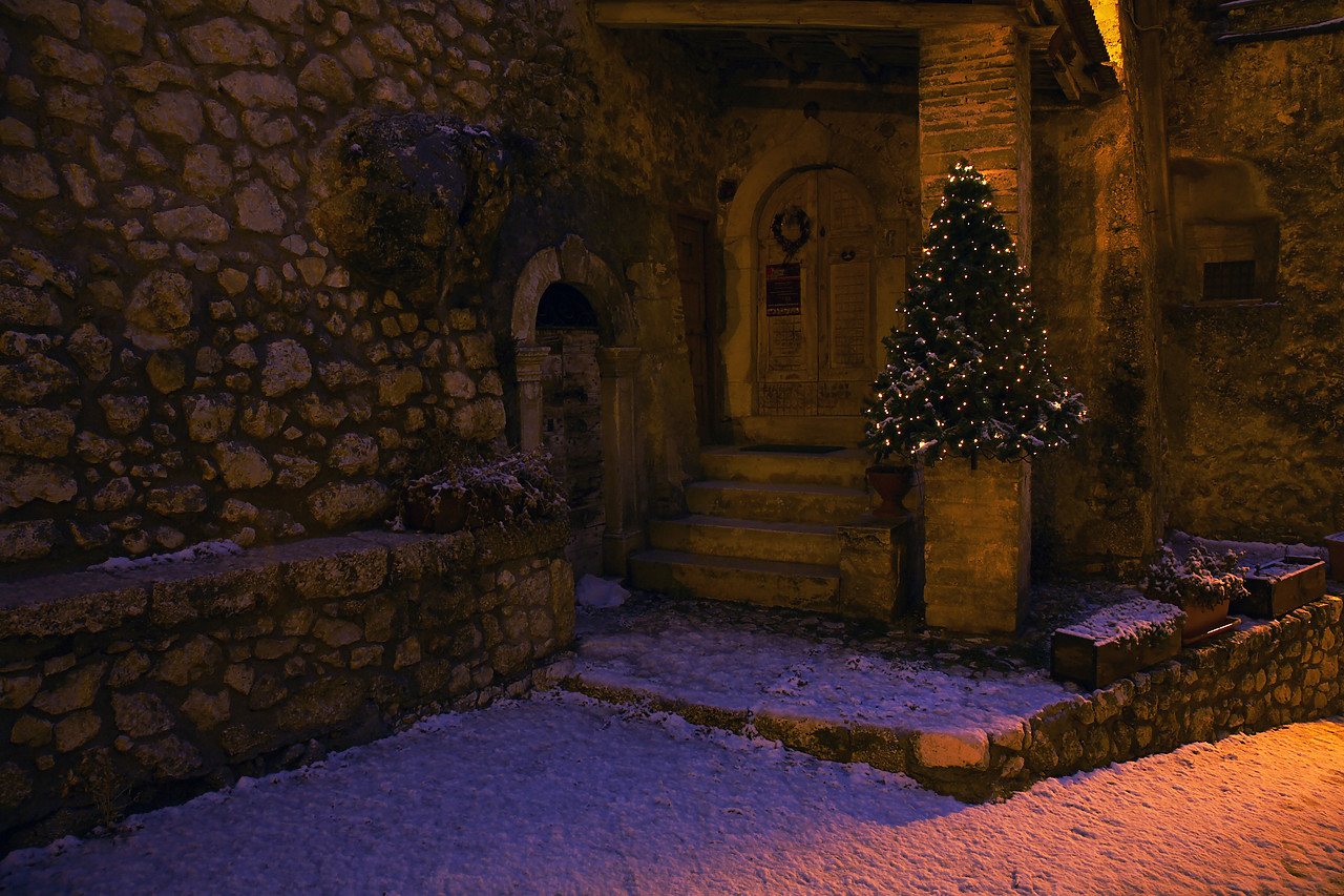#070540-1 - Christmas Tree in Snow-covered Doorway, Santo Stefano di Sessanio, Abruzzo, Italy