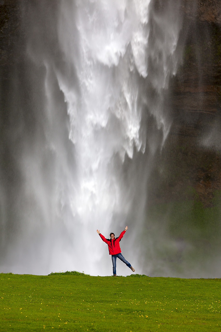 #100244-1 - Woman in Front of Seljalandsfoss Waterfall, Iceland