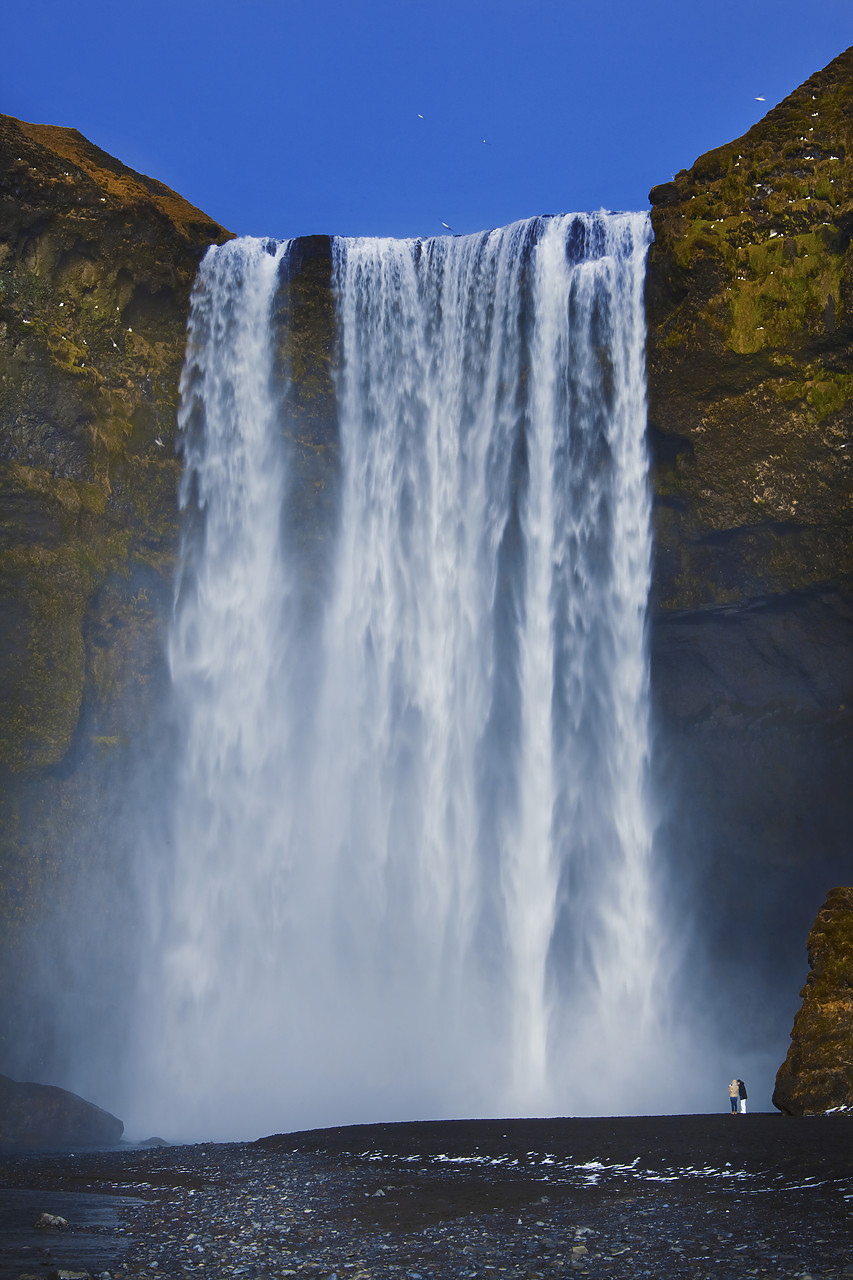 #110114-1 - Couple at Skogafoss Waterfall, Iceland