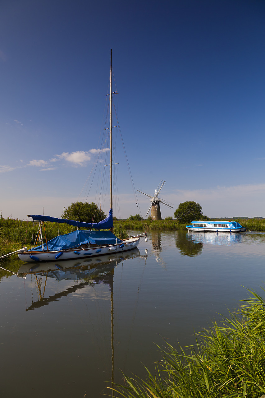 #110215-1 - Cruiser on River Thurne with St. Benet's Mill, Norfolk Broads National Park, England
