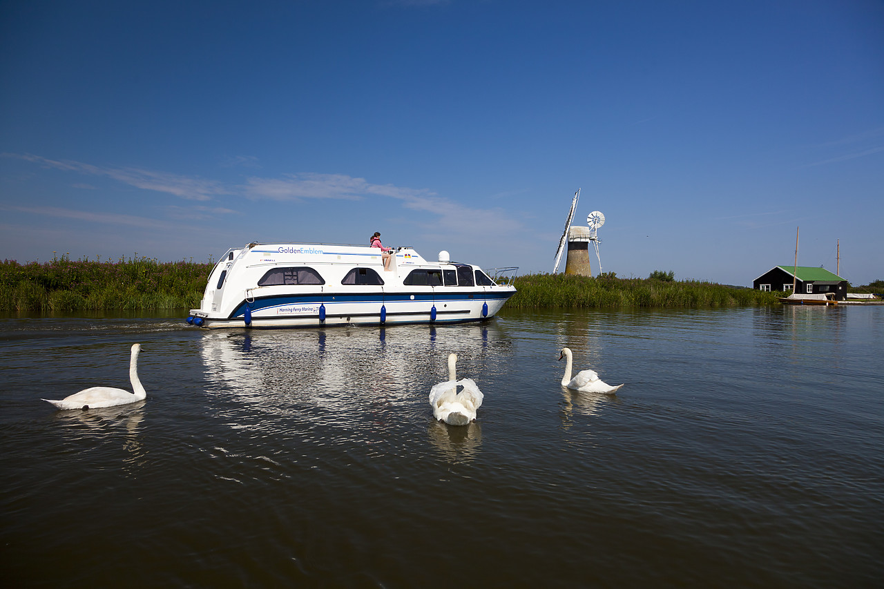 #110218-1 - Cruiser on River Thurne with St. Benet's Mill, Norfolk Broads National Park, England