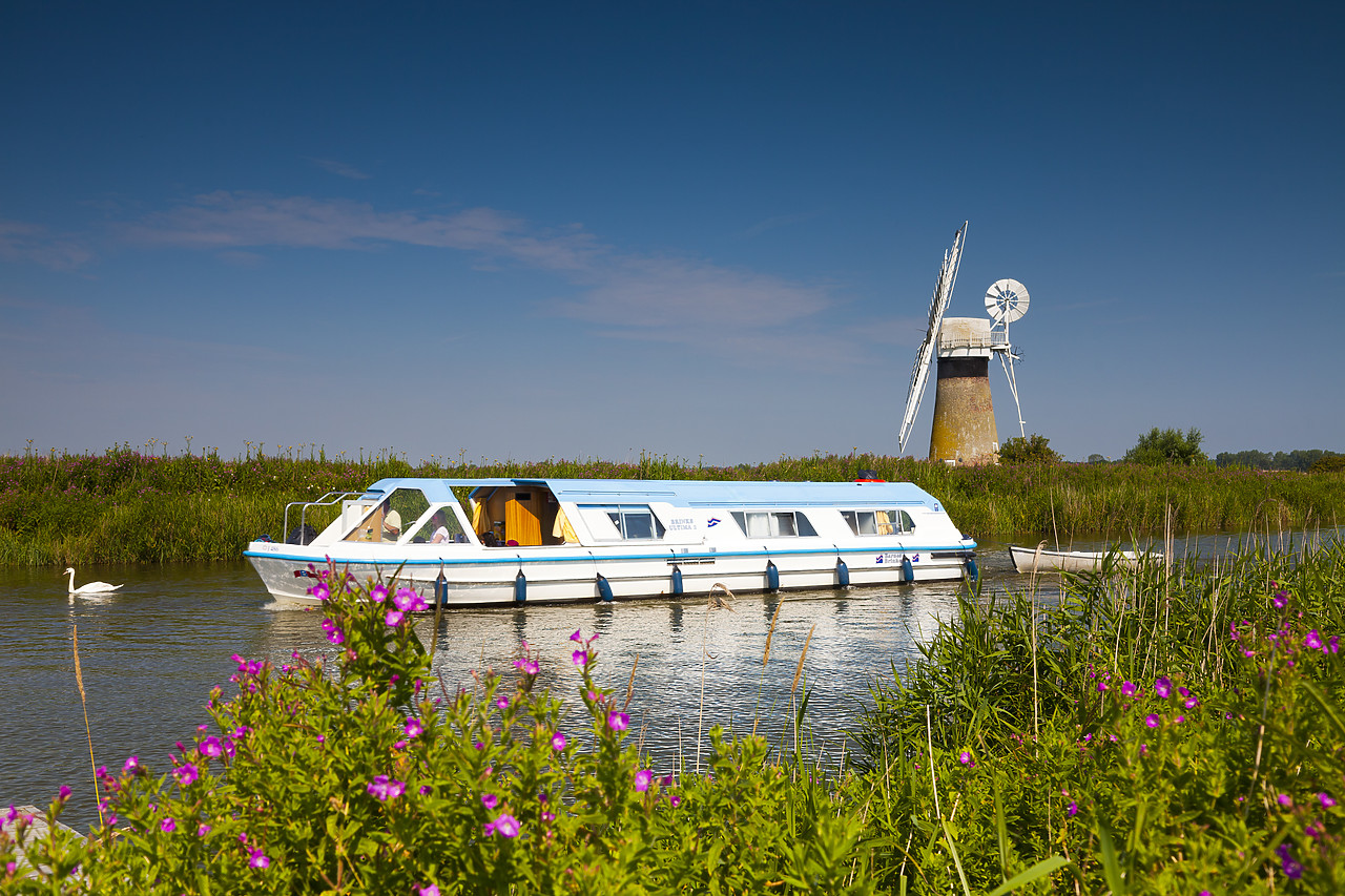 #110220-1 - Cruiser on River Thurne with St. Benet's Mill, Norfolk Broads National Park, England