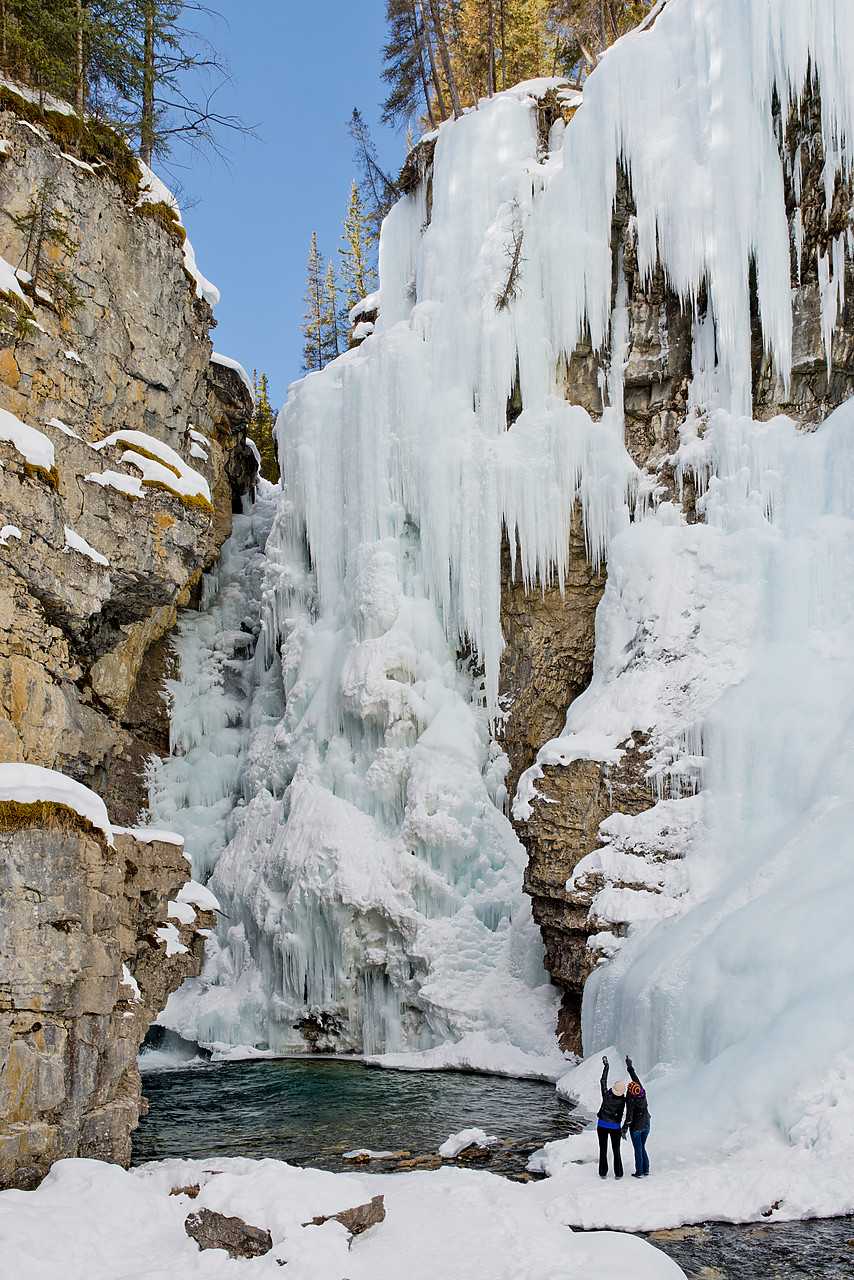 #130094-1 - Couple at Frozen Upper Johnston Falls, Banff National Park, Alberta, Canada