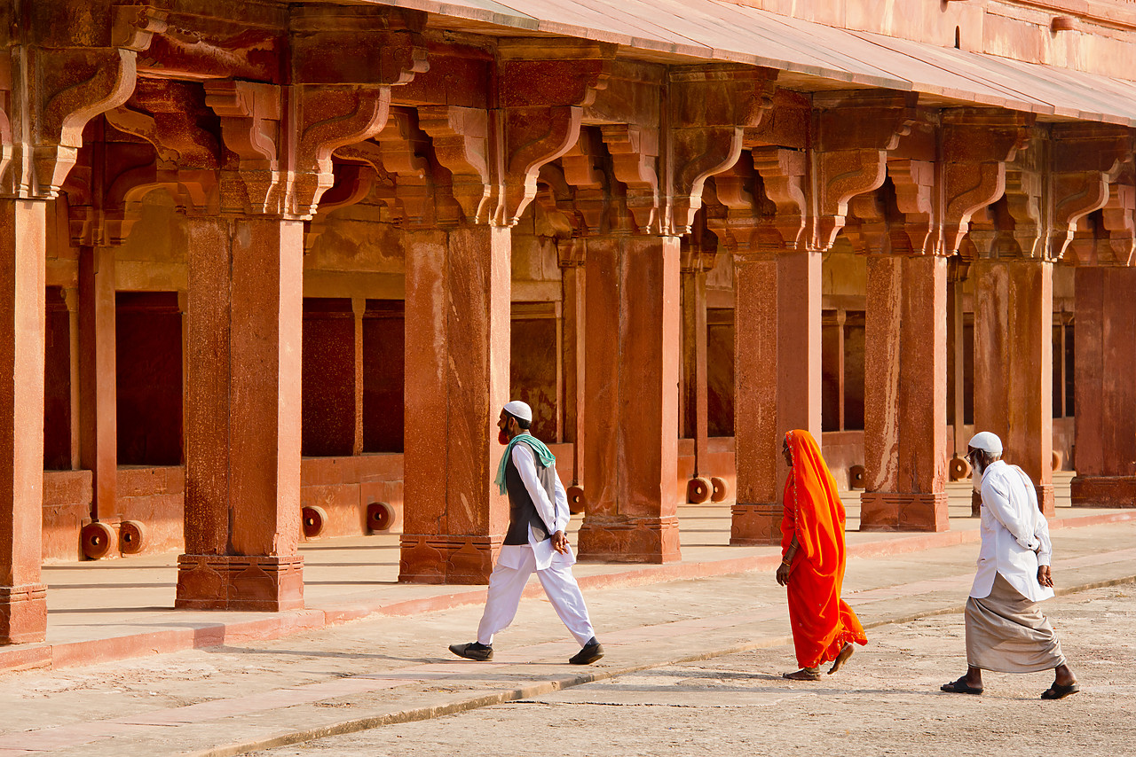 #130151-1 - Two Indian Men & Woman Walking Across Courtyard, Jodha Bai's Palace, Fatehpur Sikri, Agra, India