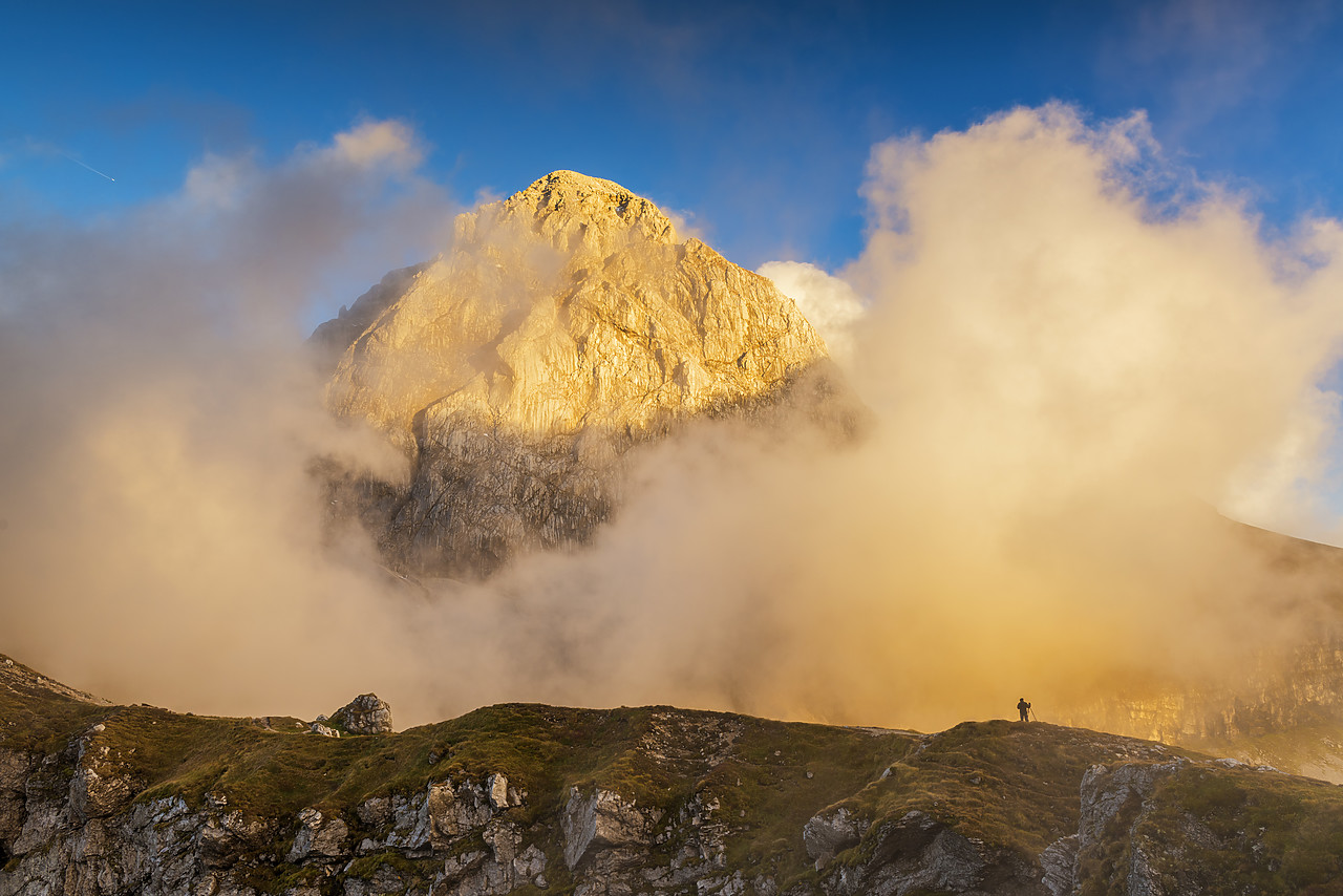 #160473-1 - Low Clouds around Mangart with Lone Person, Triglav National Park, Slovenia