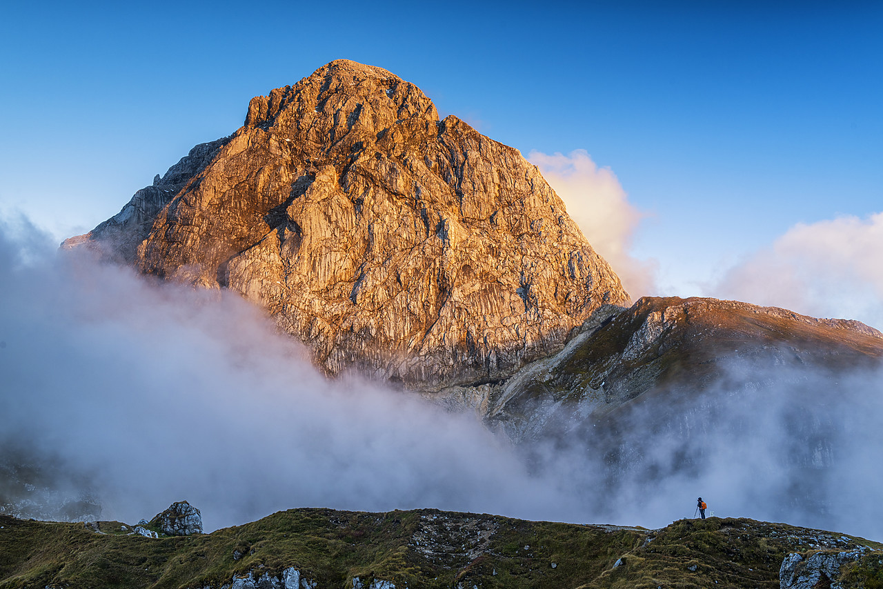 #160474-1 - Photographer Taking Pictures of Low Clouds around Mangart, Triglav National Park, Slovenia