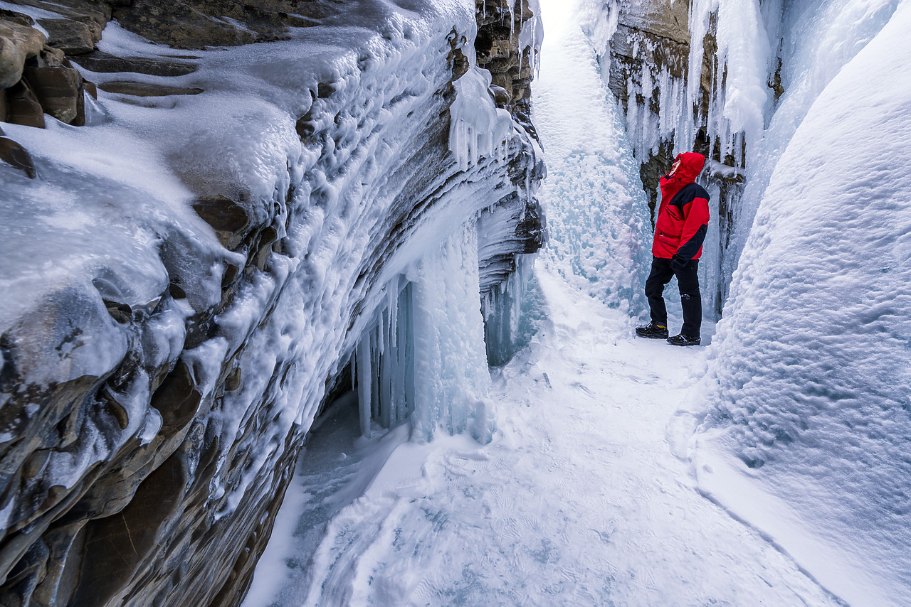 #180034-1 - Man Standing on Frozen River, Natural Bridge, Yoho National Park, British Columbia, Canada