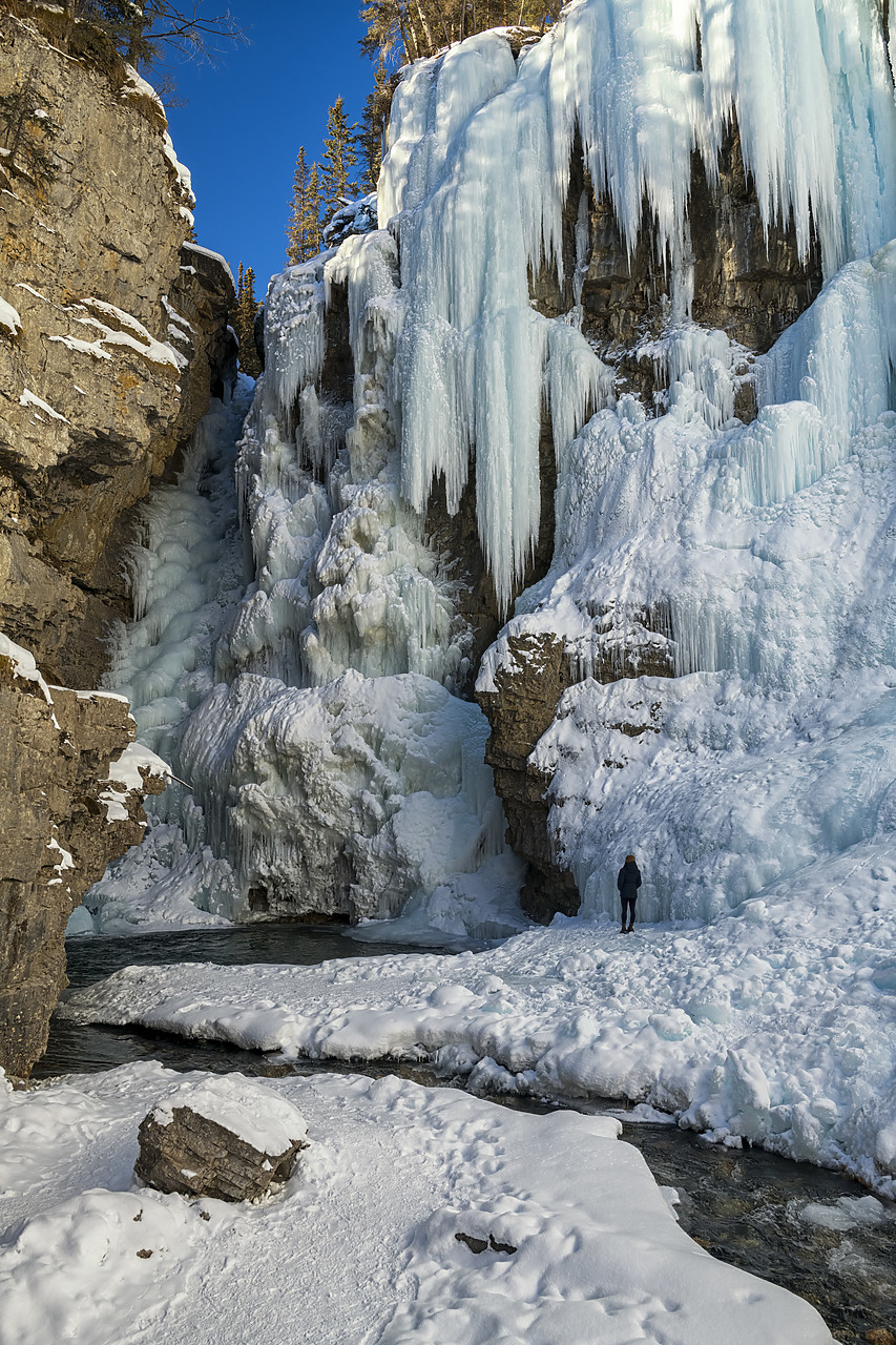 #190205-1 - Person by Frozen Upper Johnston Falls, Alberta, Canada