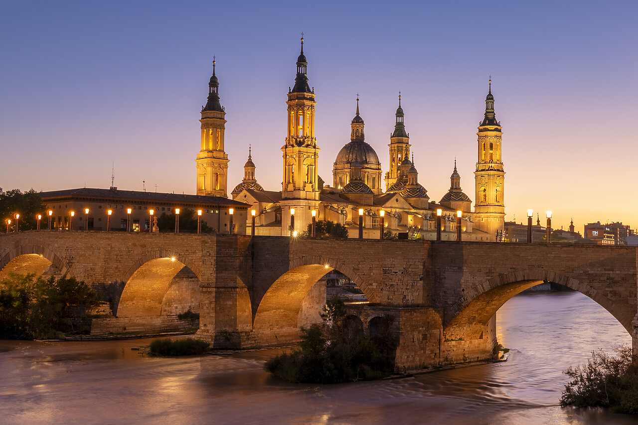 #240516-1 - Puente de Piedra and Cathedral-Basilica of Our Lady of the Pillar along Ebro River at Sunset, Zaragoza, Aragon, Spain