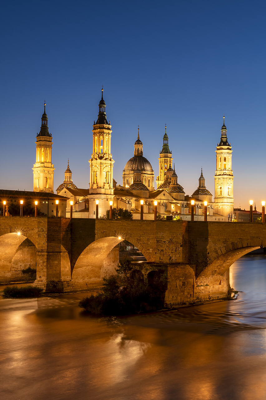 #240516-3 - Puente de Piedra and Cathedral-Basilica of Our Lady of the Pillar along Ebro River at Sunset, Zaragoza, Aragon, Spain