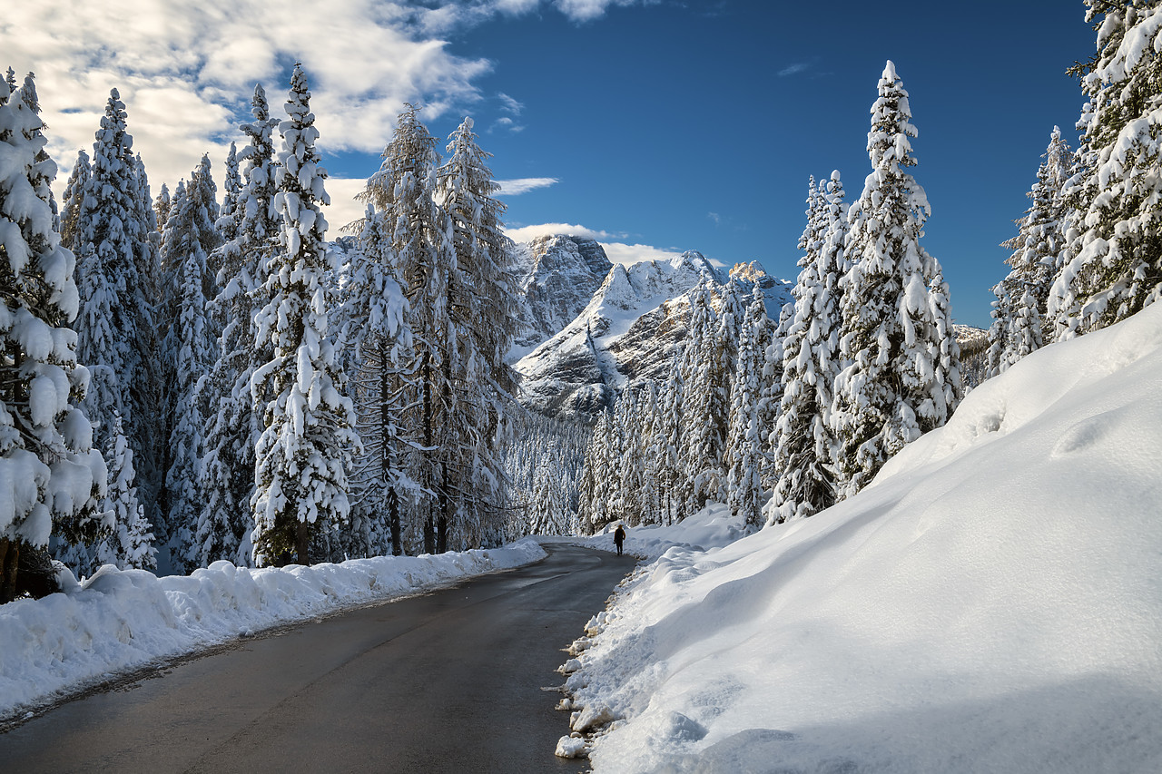 #400366-1 - Person Walking on Alpine Road in Winter, Belluno Province,  Veneto, Dolomites, Italy