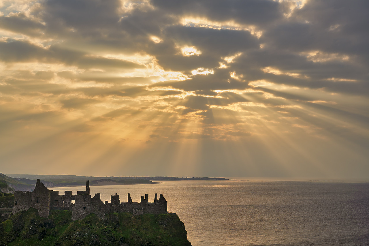 #410370-1 - Sunrays over Dunluce Castle at Sunset, County Antrim, Northern Ireland
